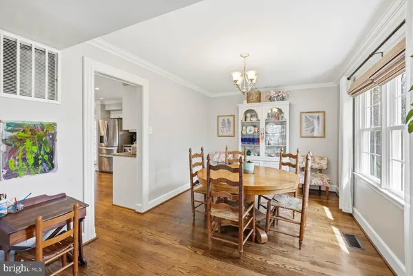 a kitchen with refrigerator and window