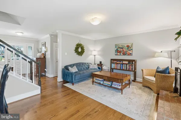 a bedroom with a balcony a bed and a chandelier