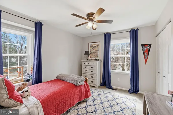 a bedroom with a bed and a couch