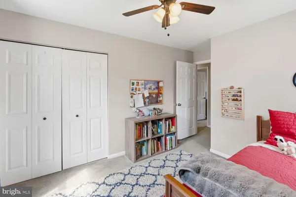 a bedroom with furniture and a fireplace