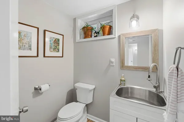 a view of a backyard with sitting area