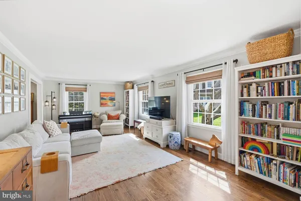 a living room with furniture or couch and a flat screen tv