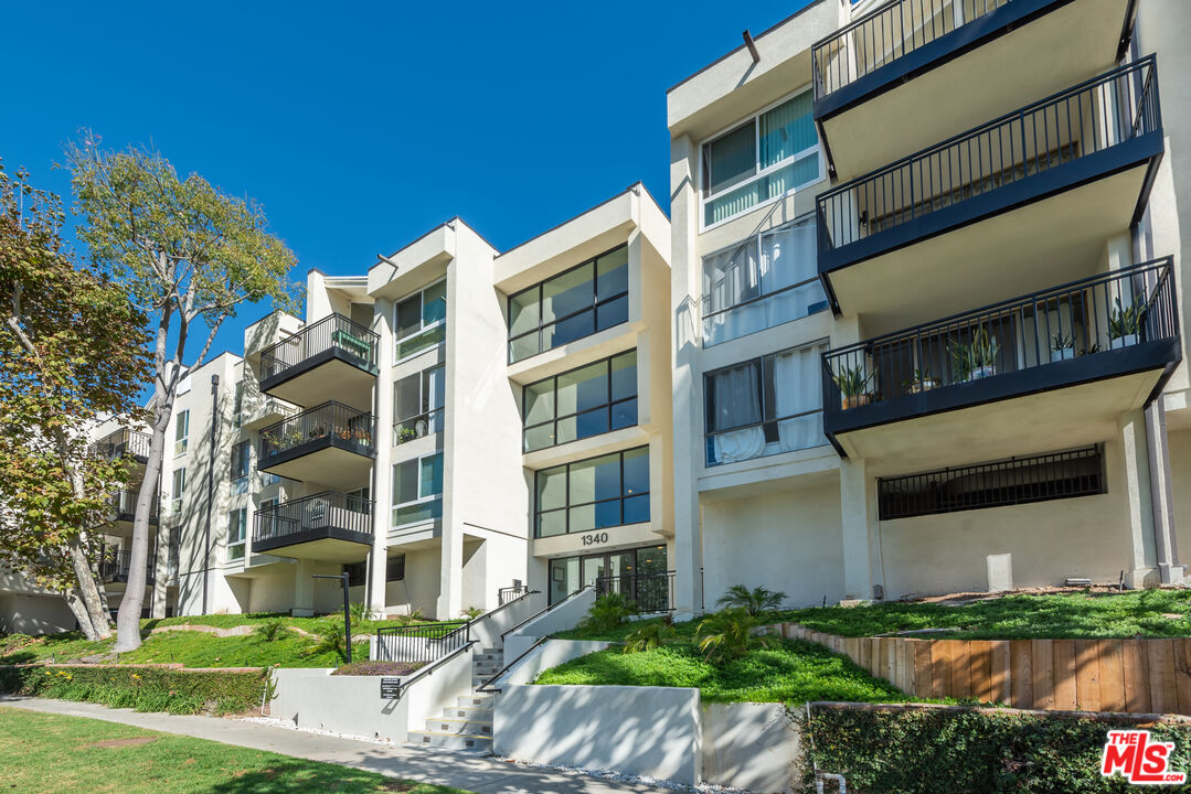 1340 South Beverly Glen Boulevard, Unit 307 Los Angeles, CA 90024 - Photo 14 of 18 a front view of a multi story building