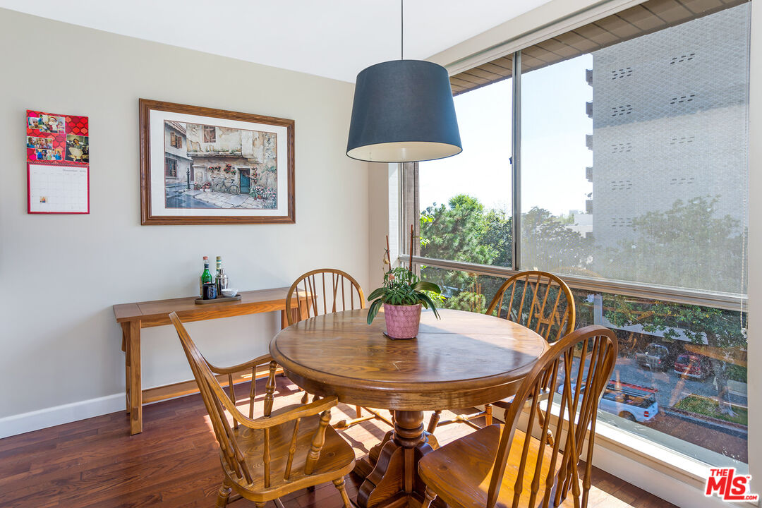 1340 South Beverly Glen Boulevard, Unit 307 Los Angeles, CA 90024 - Photo 5 of 18 a view of a dining room with furniture window and outside view