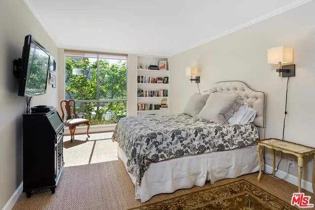 a living room with a couch and a flat screen tv
