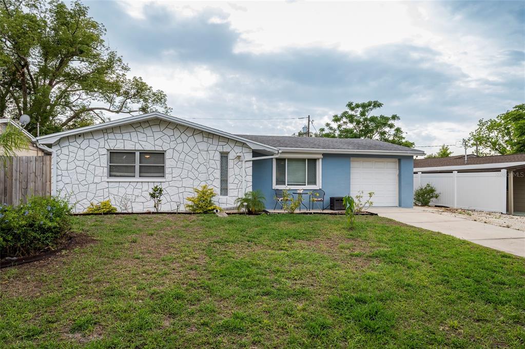 4545 Annette Street New Port Richey, FL 34652 - Photo 1 of 1 a front view of house with yard and seating