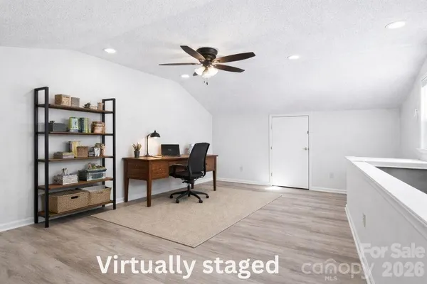 a view of a workspace with furniture