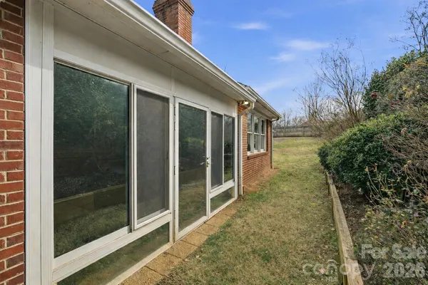 a view of a pathway both side of a house