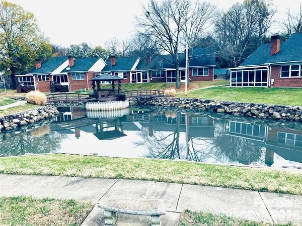 a front view of house with yard and outdoor seating