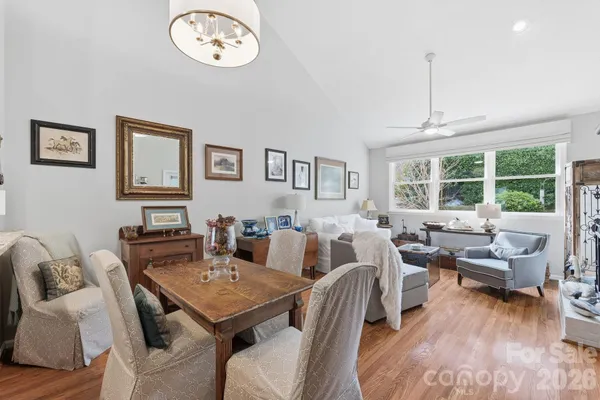 a view of a livingroom with furniture window and wooden floor