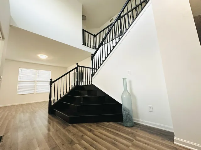 a view of a hallway with stairs