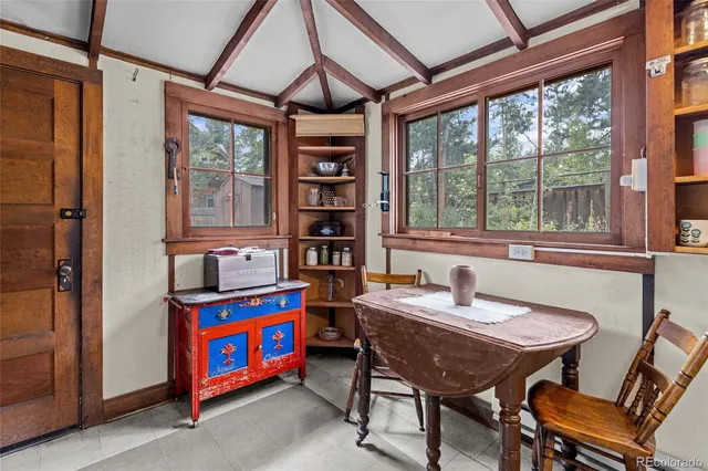 a kitchen with an oven a cabinets and a window
