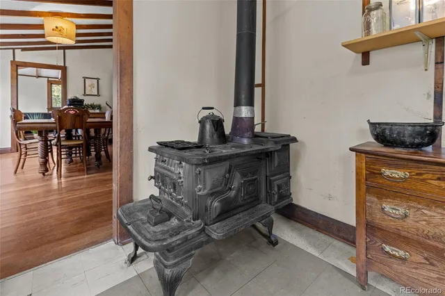 a bedroom with a bed next to a window