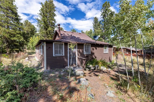 a view of living room with furniture and wooden floor