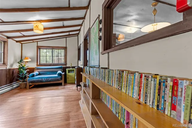 a bedroom with furniture and a window