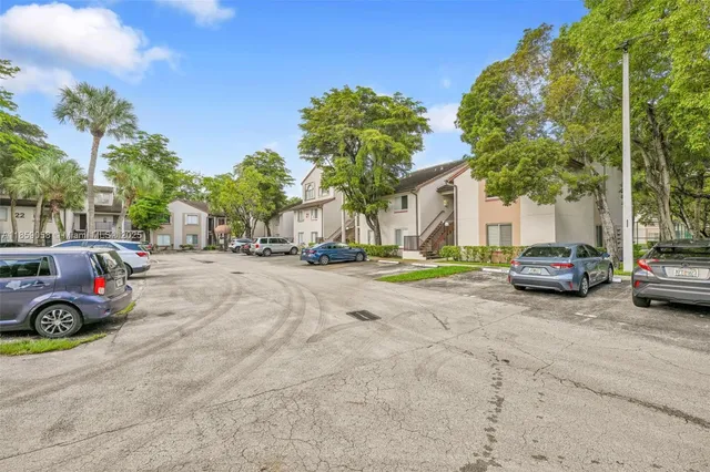 a view of street with parked cars
