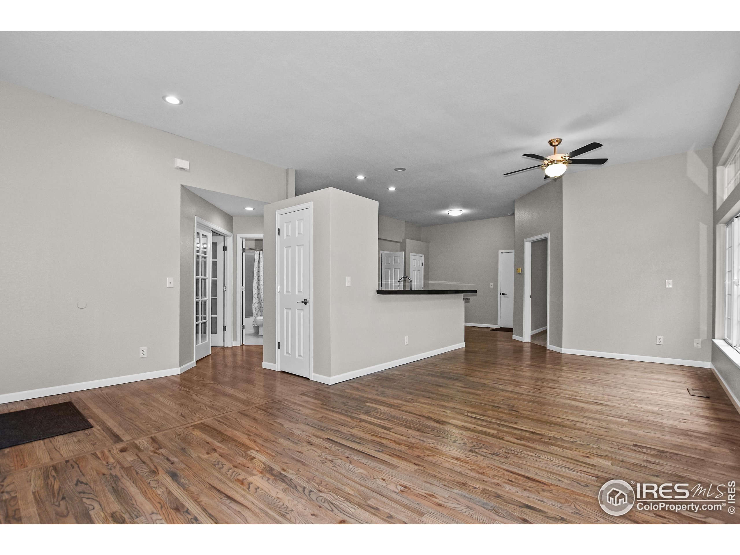 1680 Foxbrook Way Fort Collins, CO 80526 - Photo 11 of 42 a view of an empty room with a kitchen
