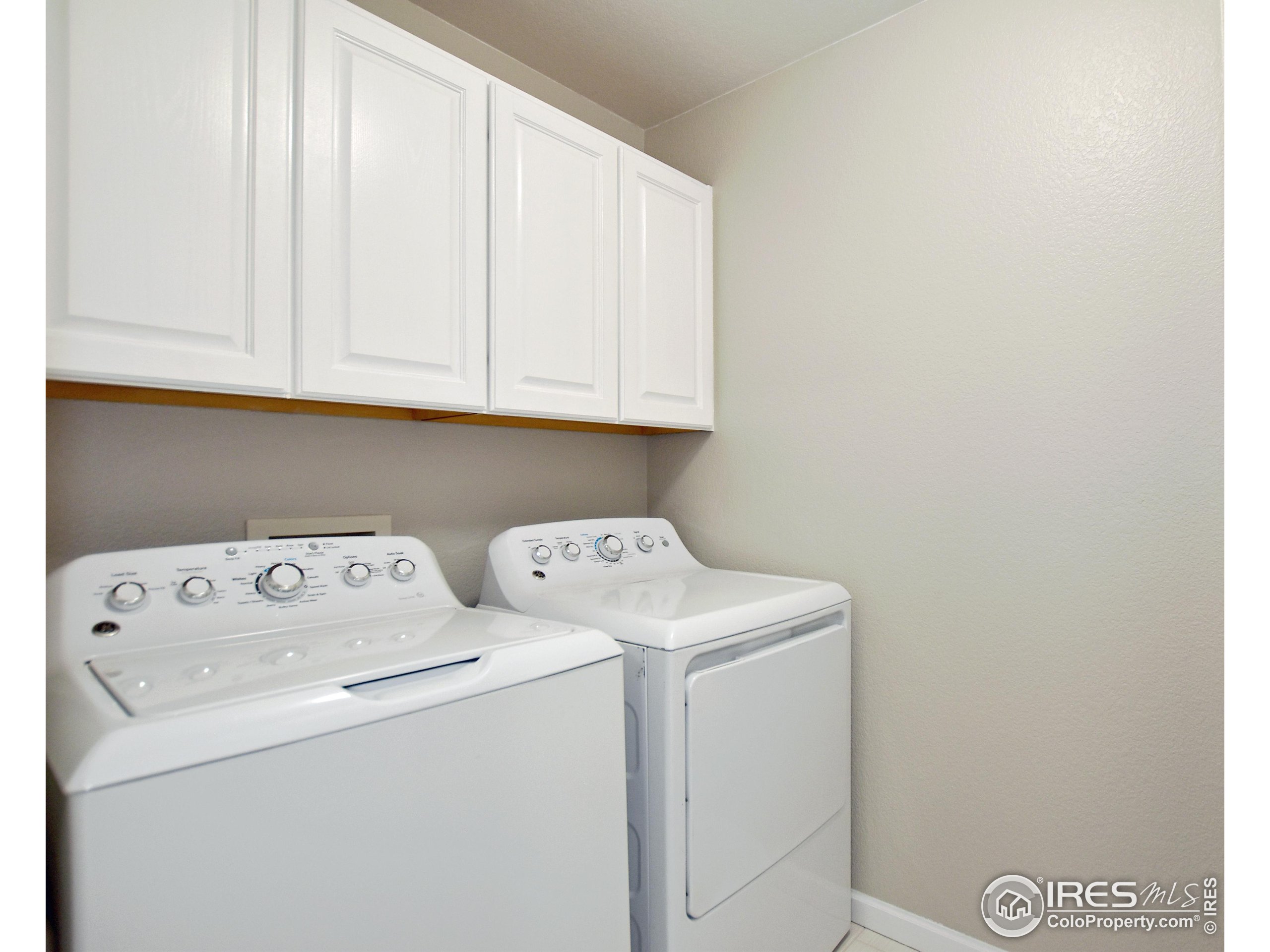 1680 Foxbrook Way Fort Collins, CO 80526 - Photo 25 of 42 a utility room with dryer and washer