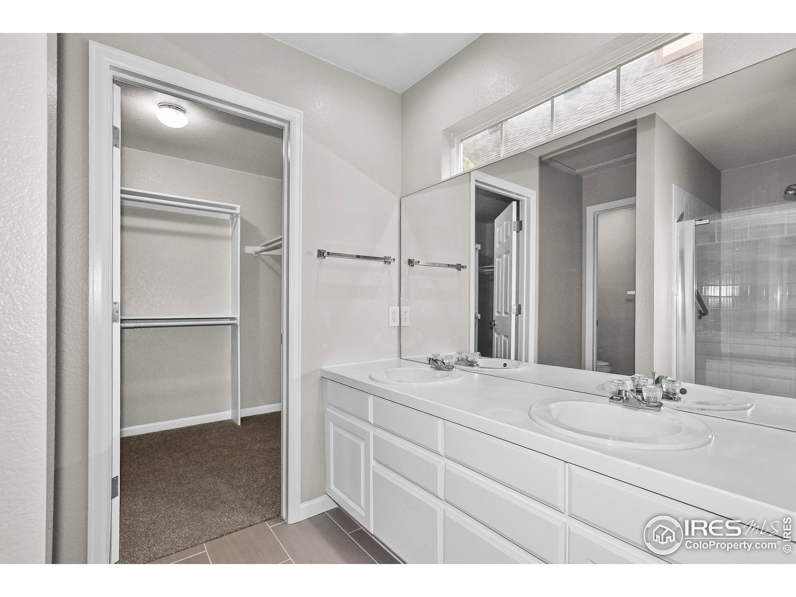 1680 Foxbrook Way Fort Collins, CO 80526 - Photo 29 of 42 a bathroom with a sink and a mirror