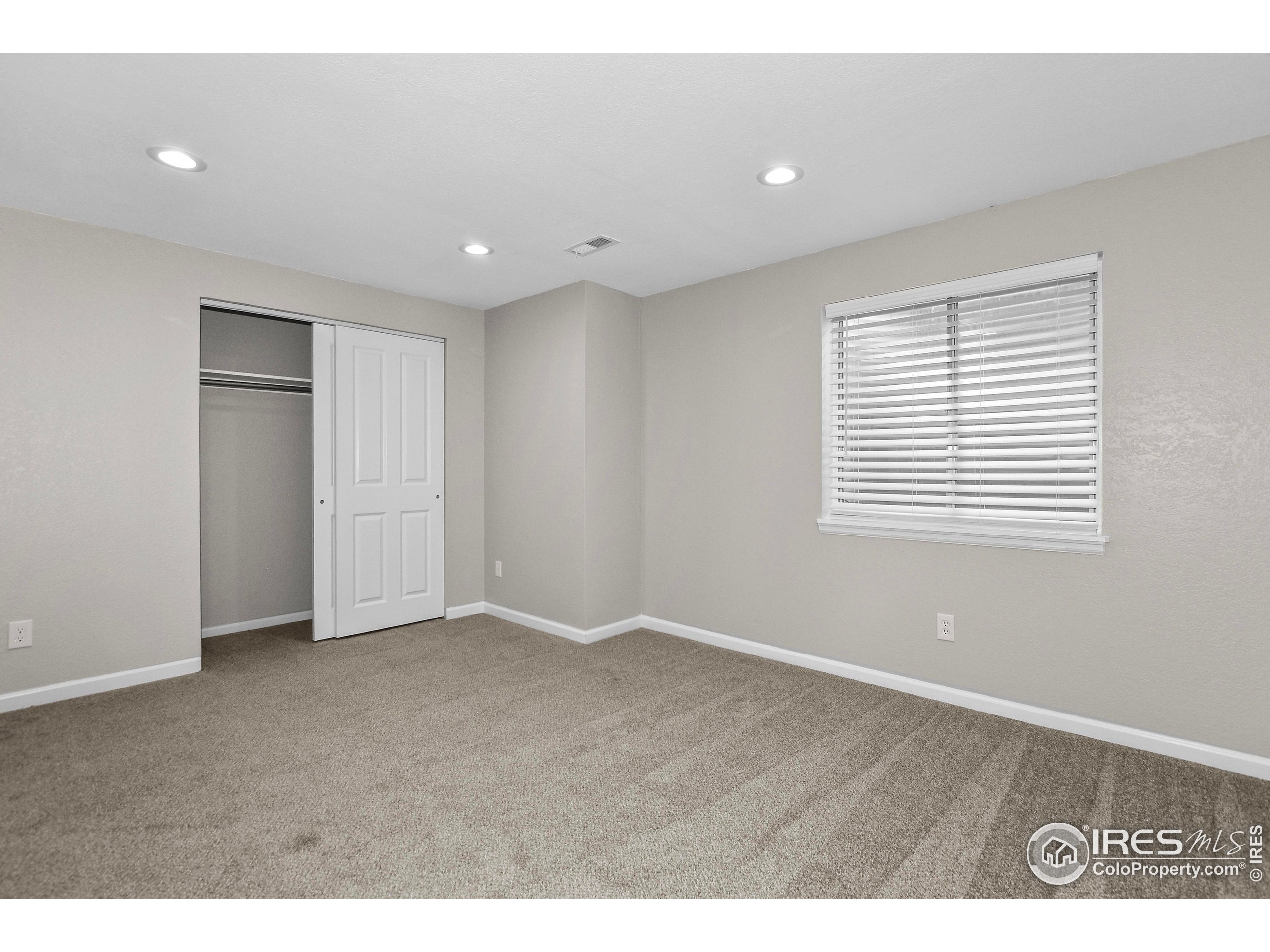 1680 Foxbrook Way Fort Collins, CO 80526 - Photo 31 of 42 a view of an empty room with a window