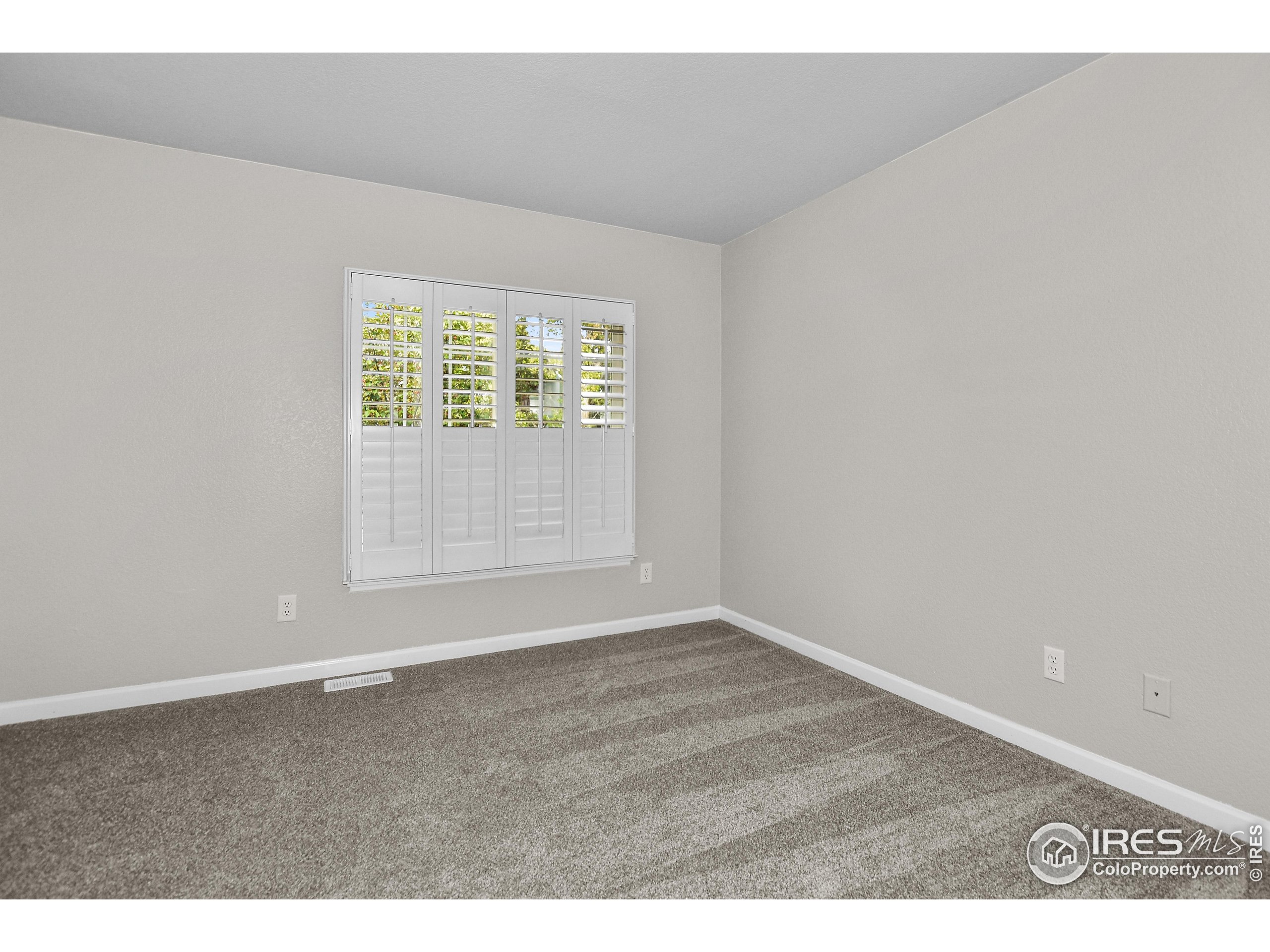 1680 Foxbrook Way Fort Collins, CO 80526 - Photo 4 of 42 an empty room with a window