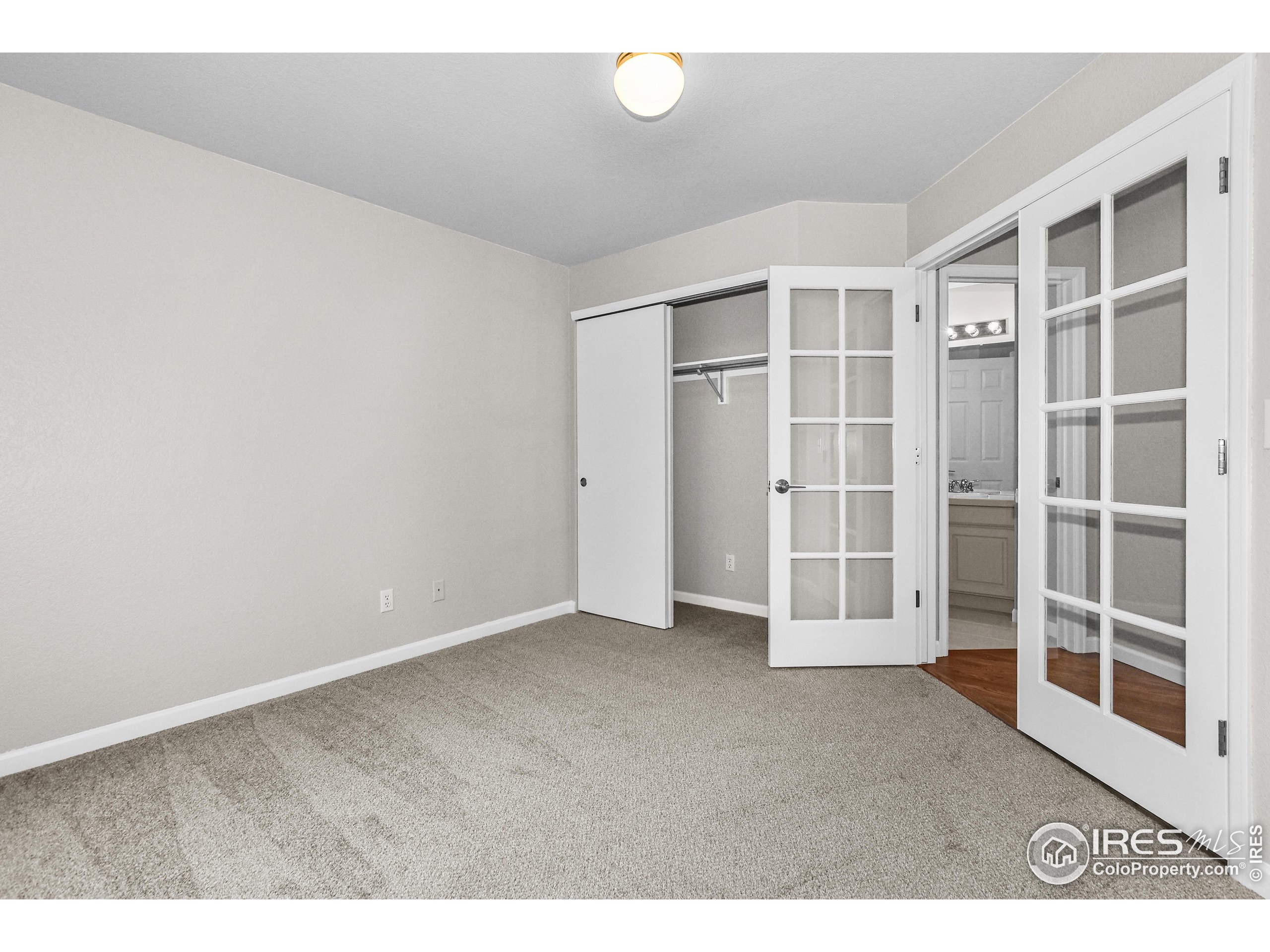 1680 Foxbrook Way Fort Collins, CO 80526 - Photo 6 of 42 a view of an empty room with a window