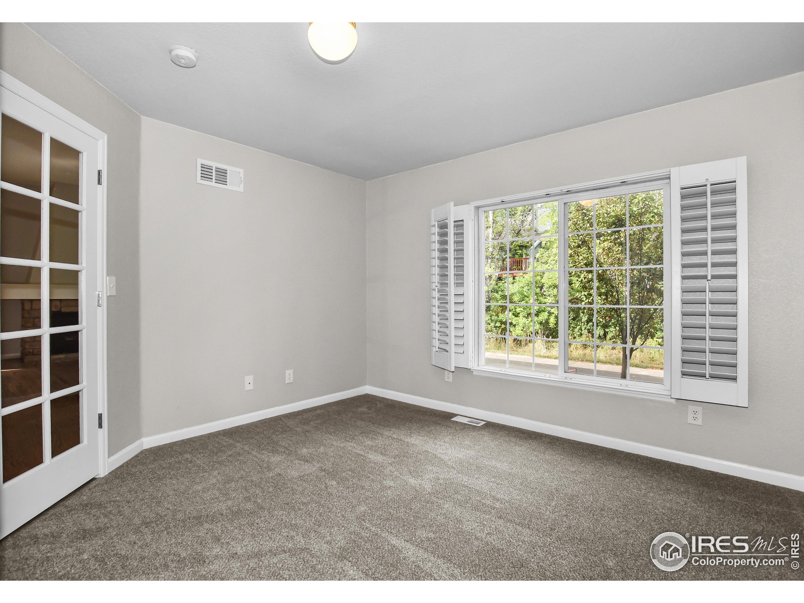 1680 Foxbrook Way Fort Collins, CO 80526 - Photo 7 of 42 a view of an empty room with a window