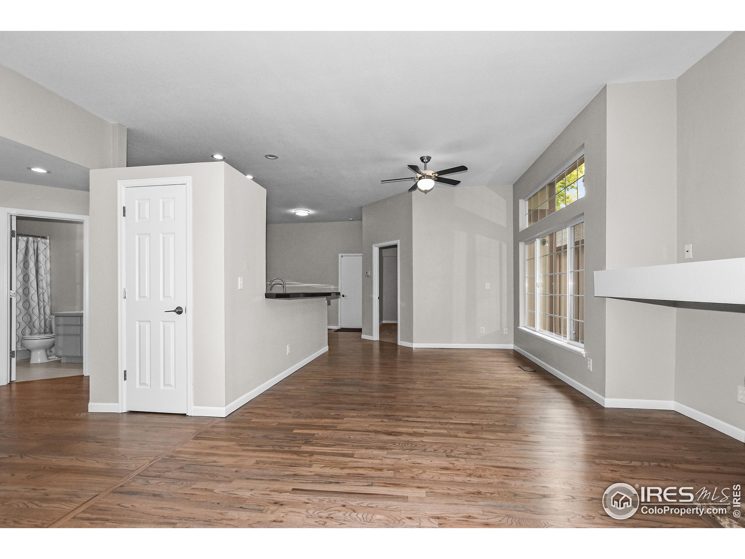 1680 Foxbrook Way Fort Collins, CO 80526 - Photo 10 of 42 a view of an empty room with wooden floor