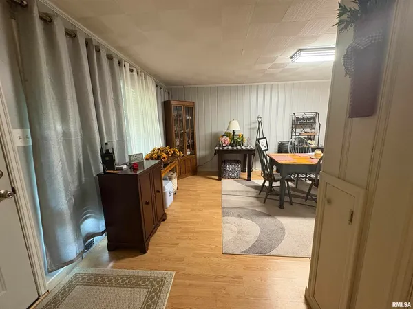 a dining room with furniture and window