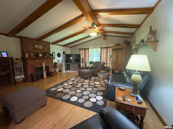 a bedroom with furniture and a flat screen tv