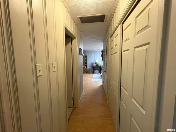 a view of a bathroom from a hallway