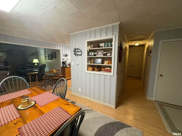 a bedroom with furniture and a wooden floor