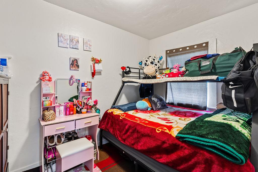 1205 Grand Avenue Santa Rosa, CA 95404 - Photo 18 of 27 a bed room with a bed and storage