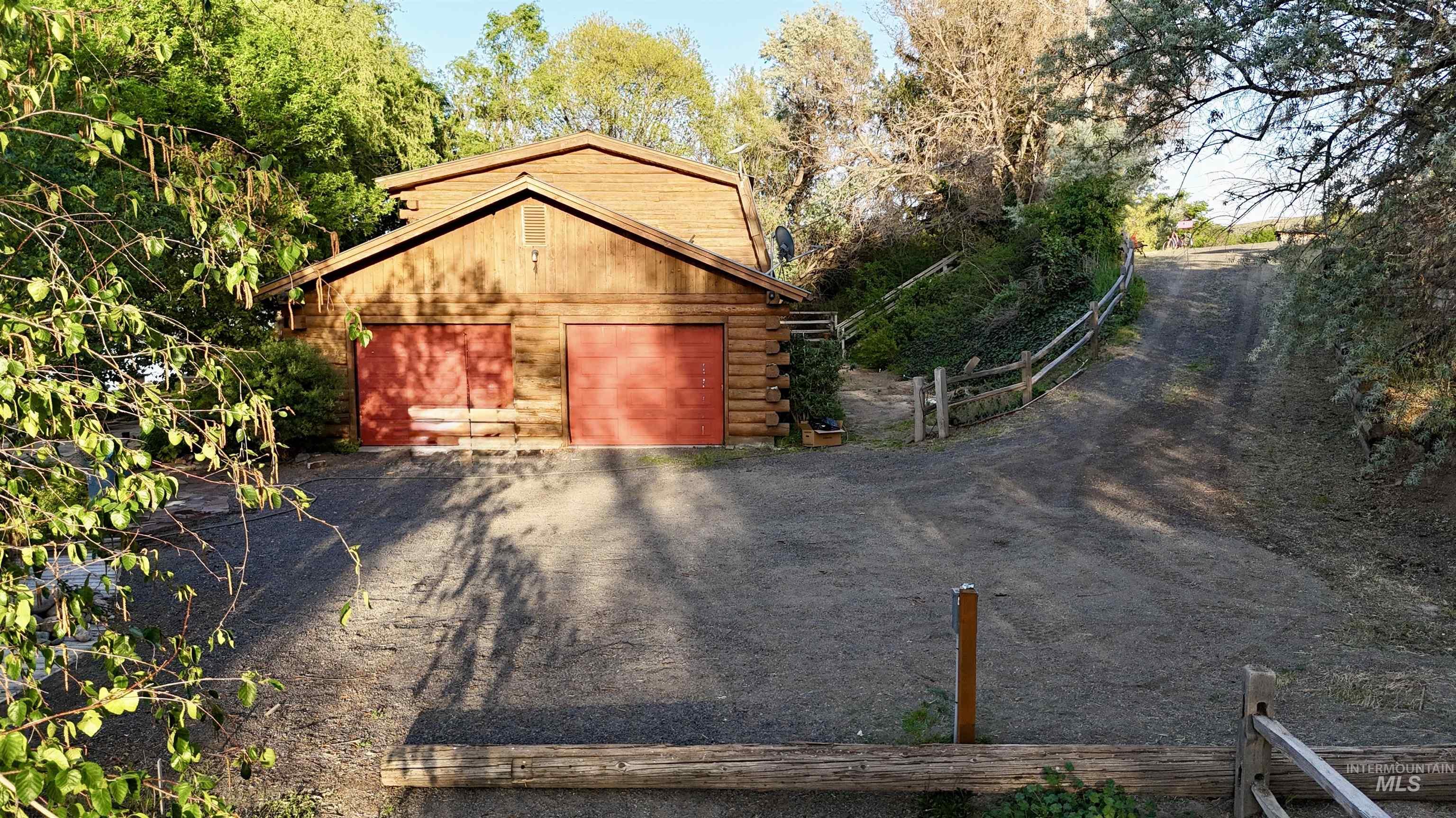 62 Bell Rapids Road Hagerman, ID 83332 - Photo 28 of 34 Wood-sided structure featuring two red garage doors