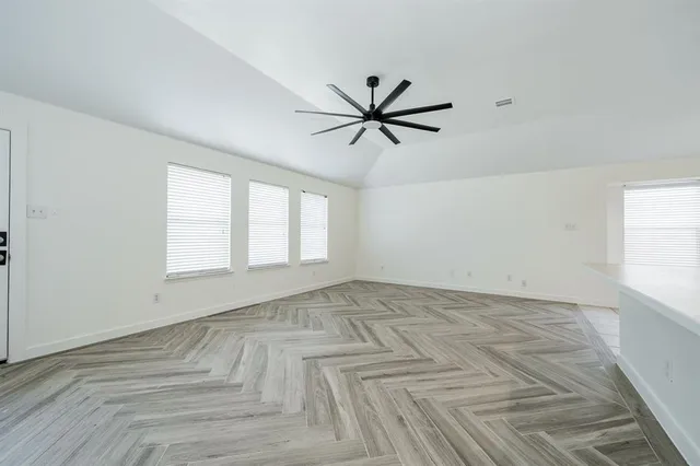 a view of an empty room with a window