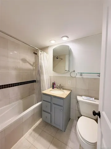 a bathroom with a toilet a sink and bathtub