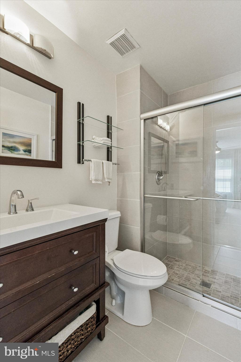 8 Hopkinson Court Chesterbrook, PA 19087 - Photo 17 of 25 a bathroom with a toilet a sink a mirror and a shower