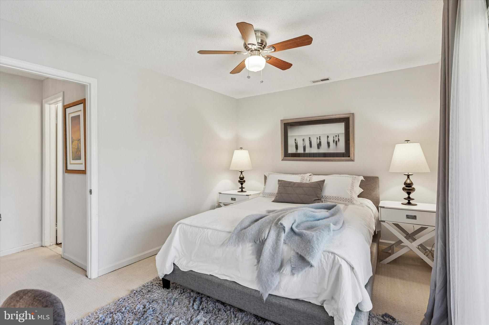 8 Hopkinson Court Chesterbrook, PA 19087 - Photo 20 of 25 a bedroom with a bed and a painting on the wall