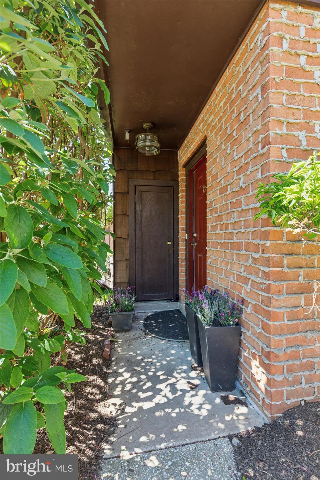 8 Hopkinson Court Chesterbrook, PA 19087 - Photo 2 of 25 a view of a house with potted plants