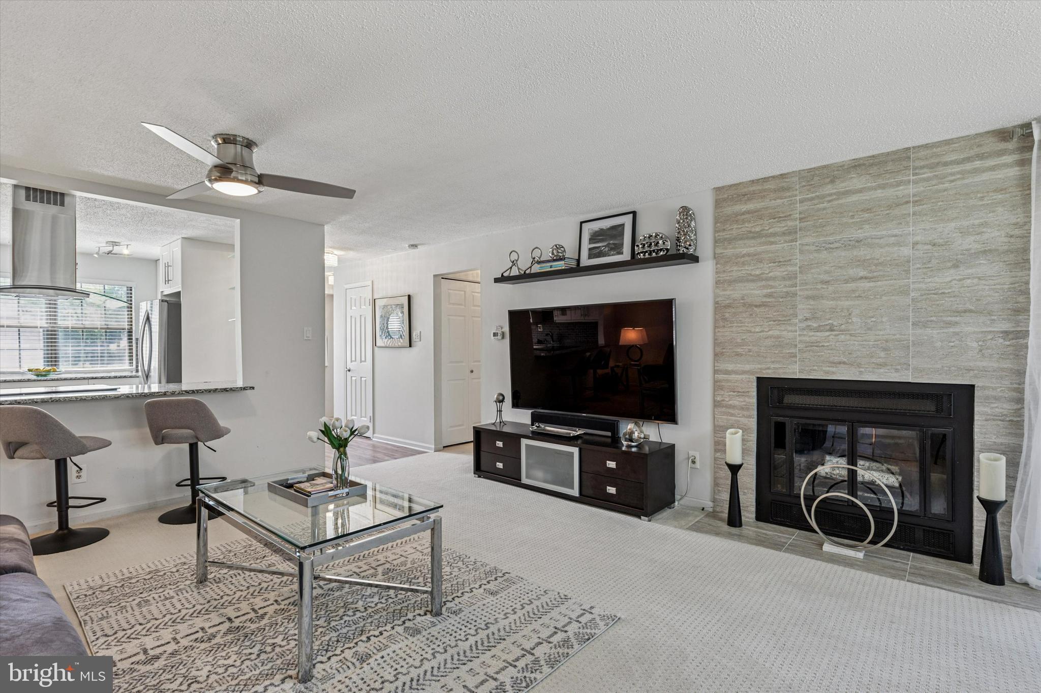 8 Hopkinson Court Chesterbrook, PA 19087 - Photo 7 of 25 a living room with furniture and a flat screen tv