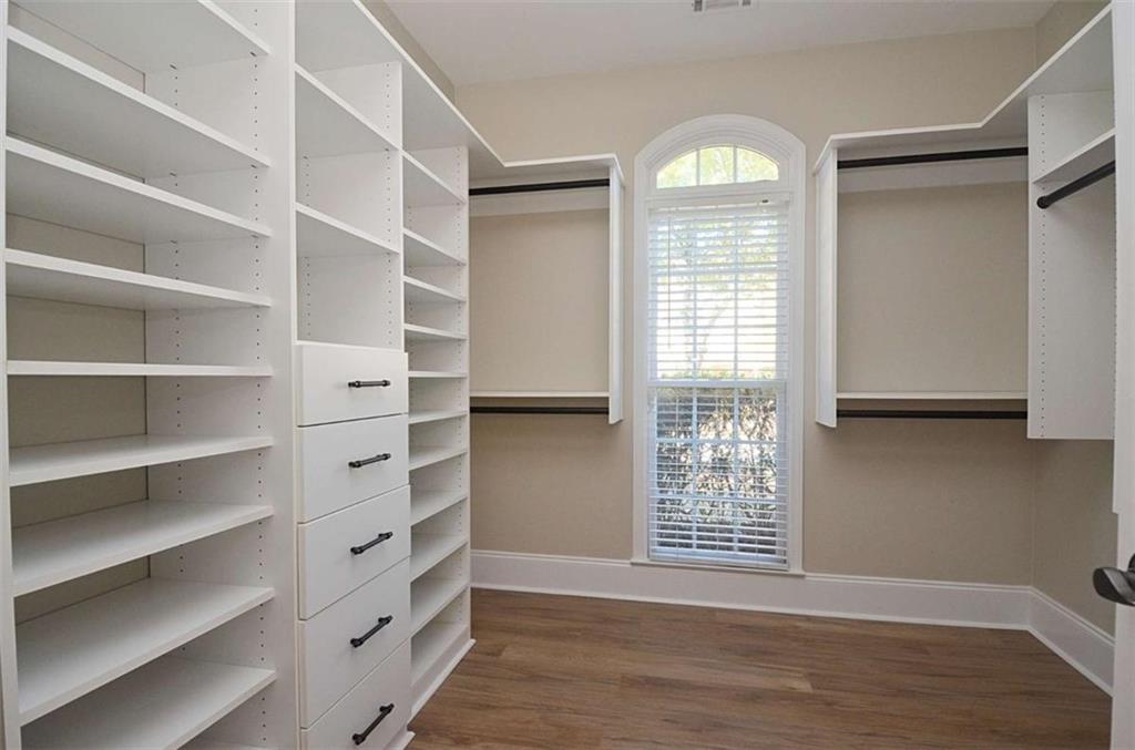 101 Whitegrass Way Grayson, GA 30017 - Photo 20 of 41 a view of an empty room with a window and wooden floor