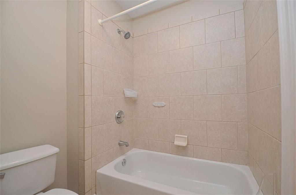 101 Whitegrass Way Grayson, GA 30017 - Photo 25 of 41 a bathroom with a bathtub and toilet