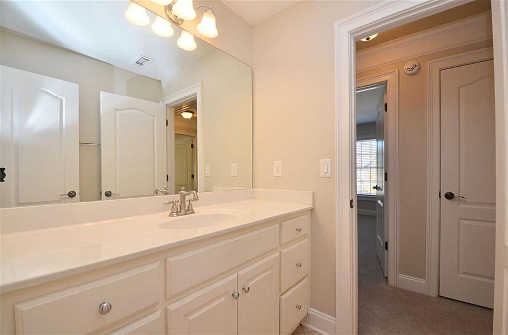 101 Whitegrass Way Grayson, GA 30017 - Photo 26 of 41 a bathroom with a sink double vanity and a mirror