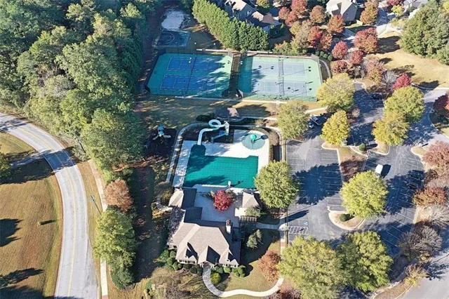 an aerial view of a house with a yard and garden