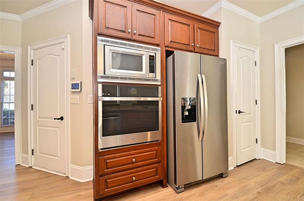 101 Whitegrass Way Grayson, GA 30017 - Photo 10 of 41 a view of kitchen with stainless steel appliances granite countertop cabinets and a window