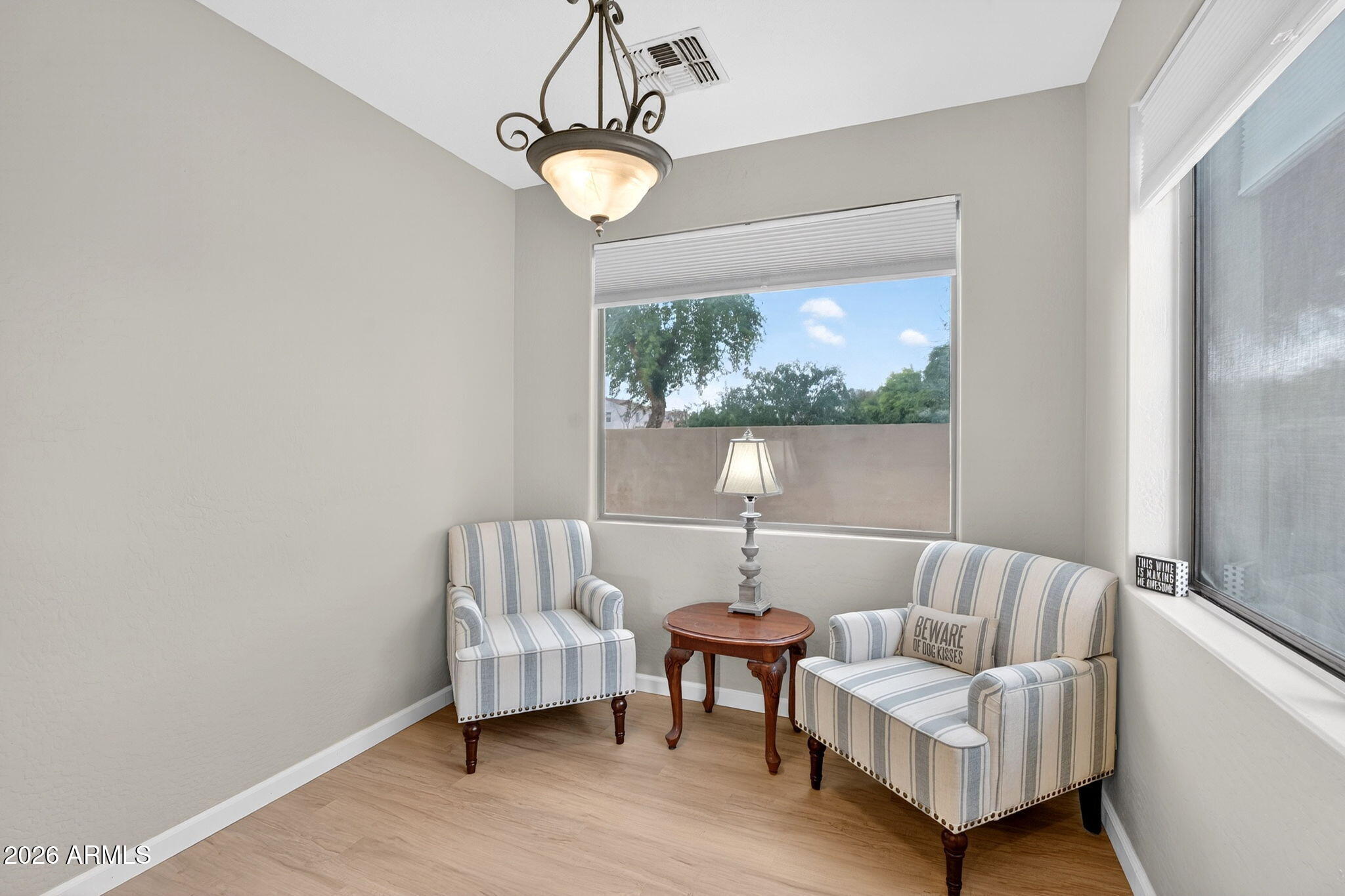 6280 South Sinova Court Gilbert, AZ 85298 - Photo 22 of 64 a living room with a couch and a large window