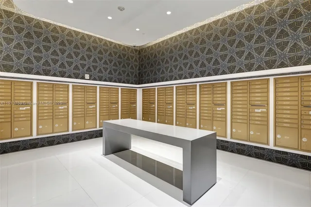 a large kitchen with a table chairs and chandelier