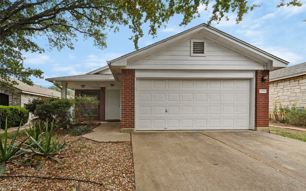 1709 Friars Tale Lane Austin, TX 78748 - Photo 2 of 24 a front view of house with yard
