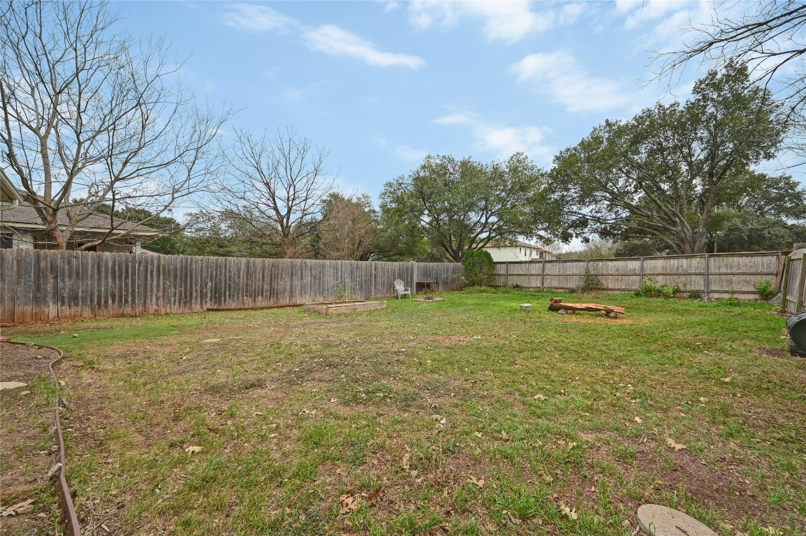 1709 Friars Tale Lane Austin, TX 78748 - Photo 21 of 24 a backyard of a house with lots of green space