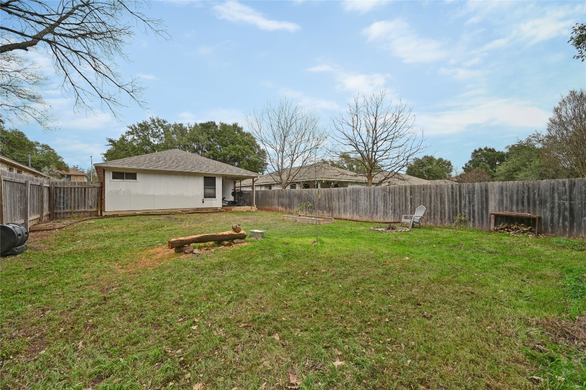 1709 Friars Tale Lane Austin, TX 78748 - Photo 23 of 24 a backyard of a house with table and chairs